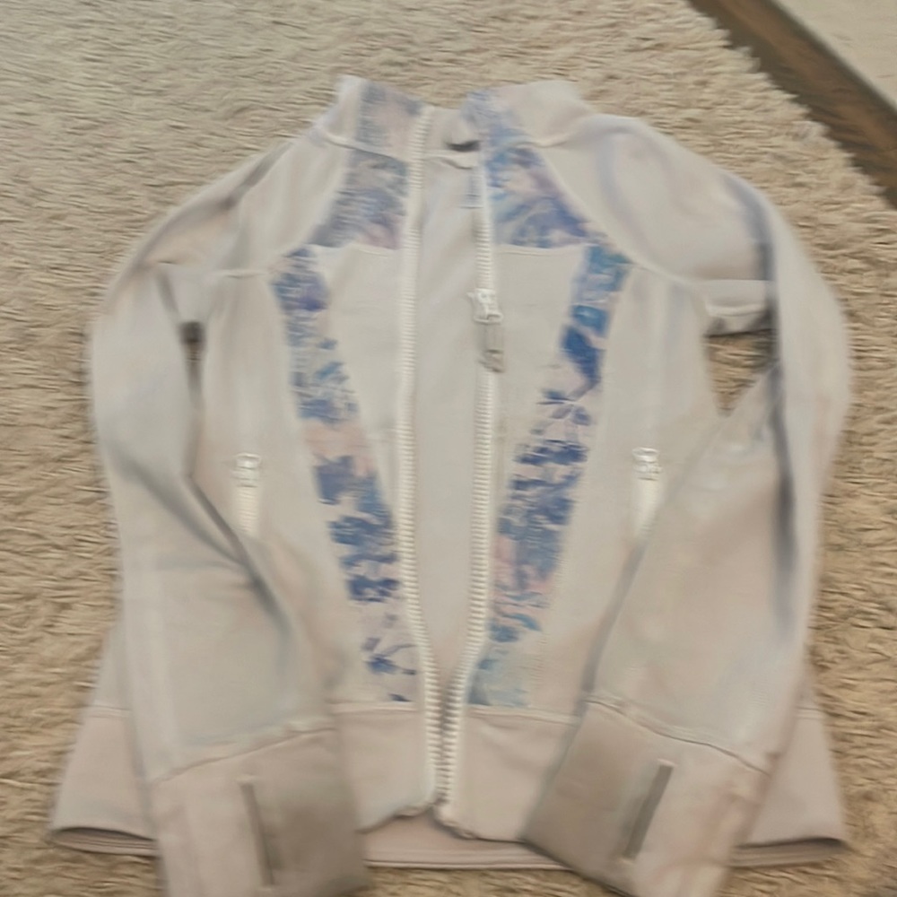 Slightly Damaged worn several times and discoloration on sleeves